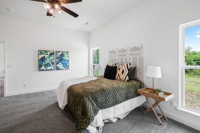 Unique bed set with blue accent paintings on wall