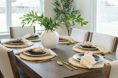 Set dinner table with plant as the center piece
