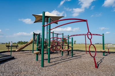 Local playground with park seating nearby